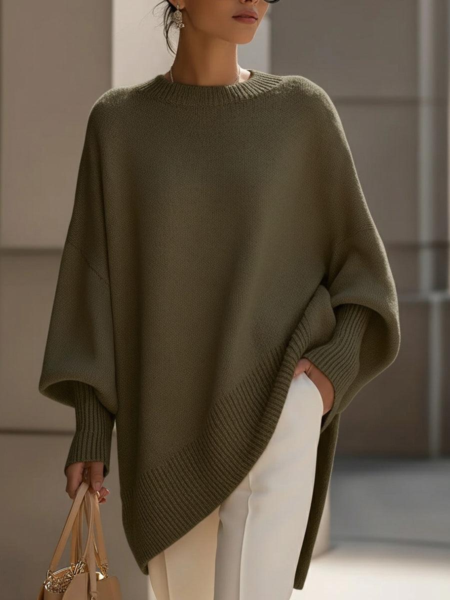 Strickponcho in Grau – kombiniert mit Denim für einen lässigen Look
